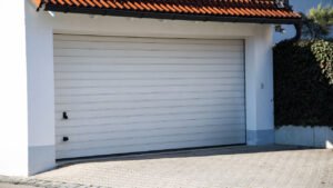 How do you recalibrate a garage door