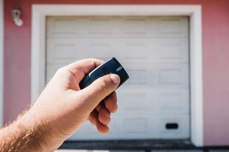 What causes a garage door to close then open back up